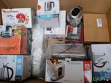 a box full of kitchen appliances and appliances on the floor