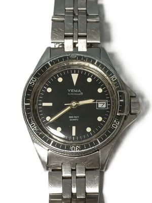a watch that is sitting on a white surface