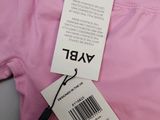 the label on a pink shirt is attached to a tag