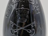bottle of wine with a skull and crossbone on the label