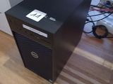 a black desktop computer sitting on top of a hard wood floor