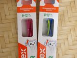 two different toothbrushes in the packaging on the table