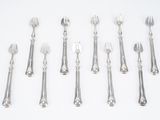 a lot of forks and spoons on the table