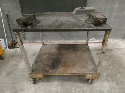 a metal table that has some tools on top of it