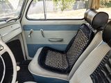 a seat in the back of a car with a steering wheel