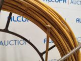 an image of a close up of a coil of wire on a rack