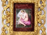 an image of a picture of a woman with a baby in a gold frame