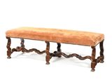 an image of a bench made of wood with a brown upholstered seat