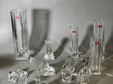 a lot of glass vases that are sitting on a table