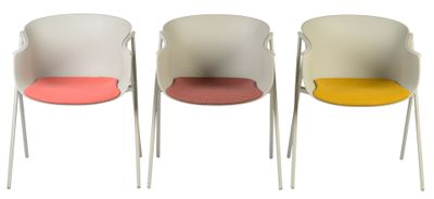 three chairs with different colored seats sit side by side on a white surface