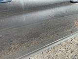 a close up of a car door with a sticker on it