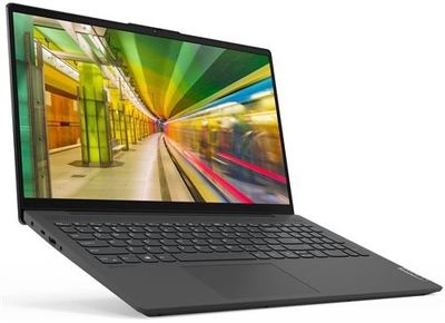 l'ordinateur portable est ouvert sur une surface blanche, avec une image floue à l'écran