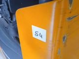 a close up of a forklift with a number plate on it