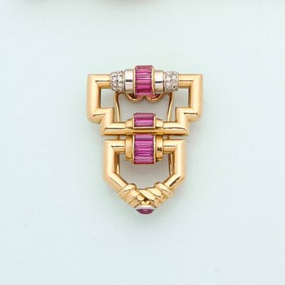 pair of pink and white stones and gold broochers on a white surface