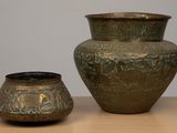 two vases that are sitting on a table