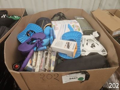 a cardboard box filled with assorted items in a room