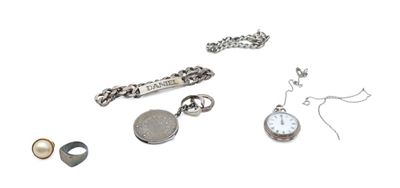 many different types of jewelry on a white surface