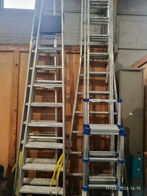 two ladders that are standing next to each other