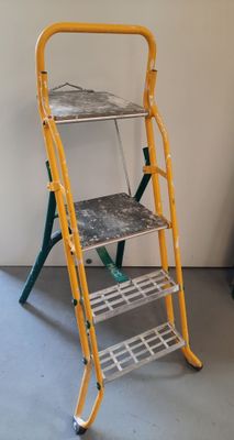 a ladder that is sitting in the corner of a room