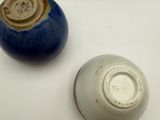four different types of vases sitting on a table