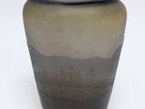 a vase that is sitting on a white surface