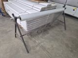 a lot of white sheets on a table in a warehouse