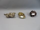 three different types of figurines are displayed on a table
