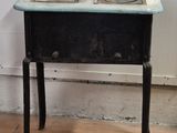 a small table with a stove on top of it