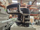 a machine that is sitting on a table in a warehouse