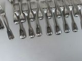 a lot of forks and spoons that are on the table