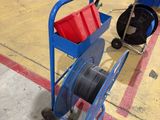 a blue cart with a red bucket and a blue cart with a red bucket on it