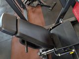 a view of a gym room with a bench, weights, and other equipment