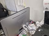 a desk with two laptops and a printer on it