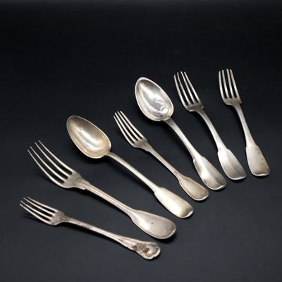 six forks and spoons are arranged in a row on a black surface