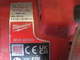 a close up of a red machine that is on a table