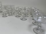 a lot of wine glasses sitting on a table