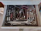 a box full of tools that are sitting on the floor