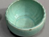 a small bowl and a smaller bowl sitting on a table