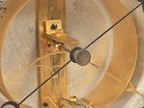 a close up of a gold clock with numbers on it