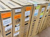 boxes of samsung electronics stacked on top of each other in a warehouse