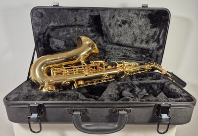 a saxophone that is in a case on a table