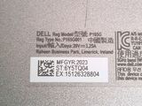 a label on the back of a laptop that says dell