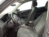 the interior of a car with a steering wheel, dashboard, and dashboard controls