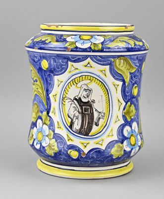 une image représentant un vase bleu et jaune orné d'une effigie de saint