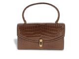 a brown crocodile skin handbag on a white background