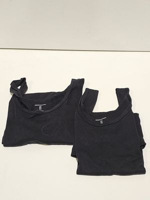 two black t - shirts on a white surface with a white background