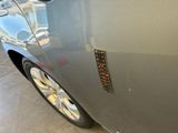 a close up of a car door with a sticker on it