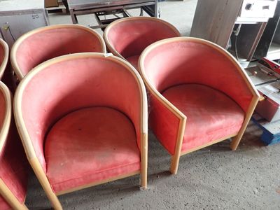 four chairs that are sitting in a room together