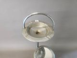 a silver plate with a spoon and a bowl on it