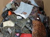 a cardboard box full of clothes and other items